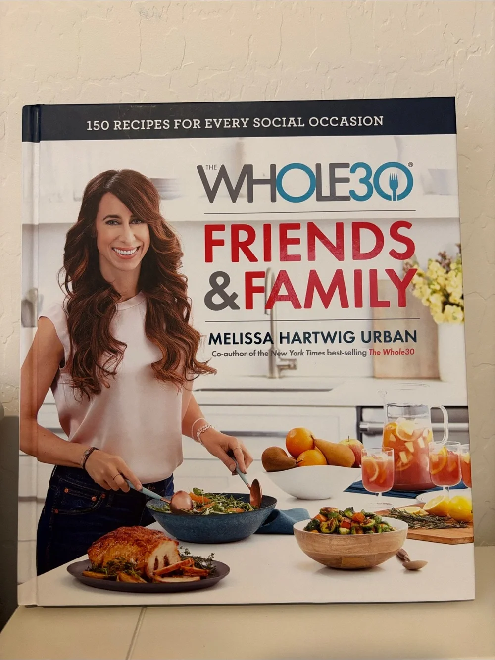 Friends & Family Cookbook & wooden cutting board.